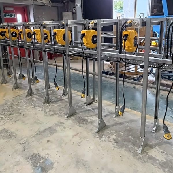 Commercial electrical reel station installation with multiple industrial power outlets and cable reels