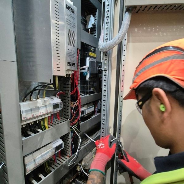 Nova Electrical engineer testing and inspecting industrial electrical equipment during compliance works